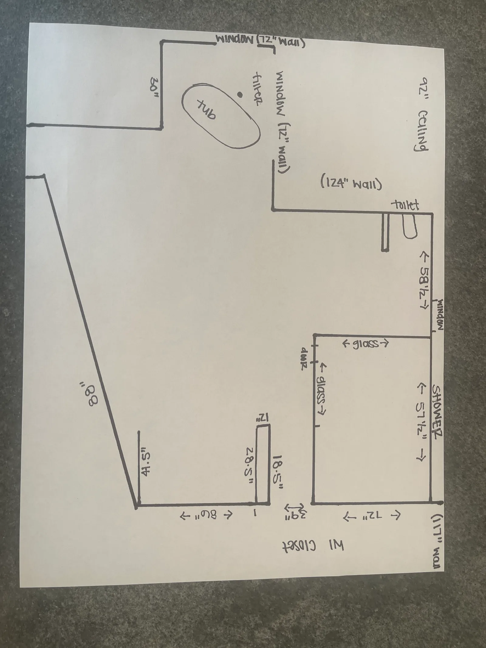 Hand-drawn master bathroom floor plan with measurements for the tub, shower, toilet and walk-in closet