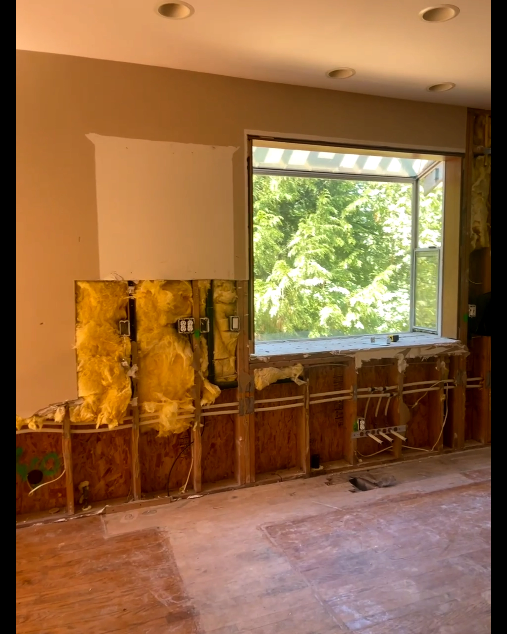Open-plan kitchen before renovation — bare pre-construction space
